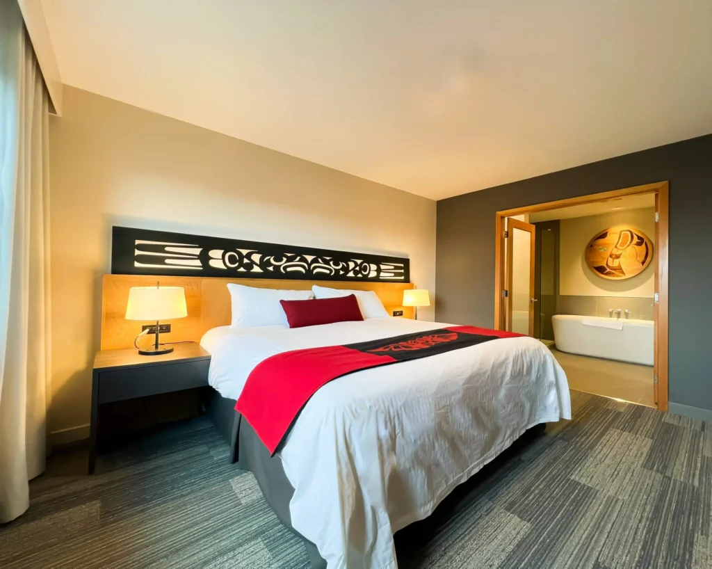 Wide angle shot of the Executive King Suite at Kwa'lilas Hotel.